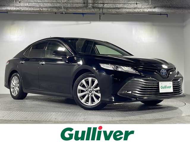 トヨタ カムリ G 沖縄県 2018(平30)年 5.9万km アティチュードブラックマイカ 県外仕入/禁煙車/純正SDナビ/CD/DVD/SDBT/フルセグ/バックカメラ/アダプティブクルーズコントロール/レーンキープアシスト/横滑り防止装置/アイドリングストップ/オートマチックハイビーム/LEDヘッドライト/オートライト/パワーシート/純正17インチAW/純正フロアマット/プッシュスタート/スマートキー/取扱説明書/後席自動開閉装置（元タクシー使用）