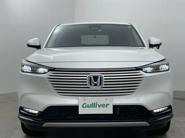 ホンダ ヴェゼル ハイブリッド e:HEV Z 岡山県 2021(令3)年 4.8万km プラチナホワイトパール ホンダコネクトディスプレイ/（Bluetooth/フルセグTV/Carplay/USB）/ハーフレザーシート/衝突軽減ブレーキ/レーダークルーズコントロール/ビルトインＥＴＣ２．０/ＬＥＤヘッドライト/シートヒーター/ステアリングヒーター/バックカメラ/オートハイビーム/置くだけ充電/コーナーセンサー/パドルシフト