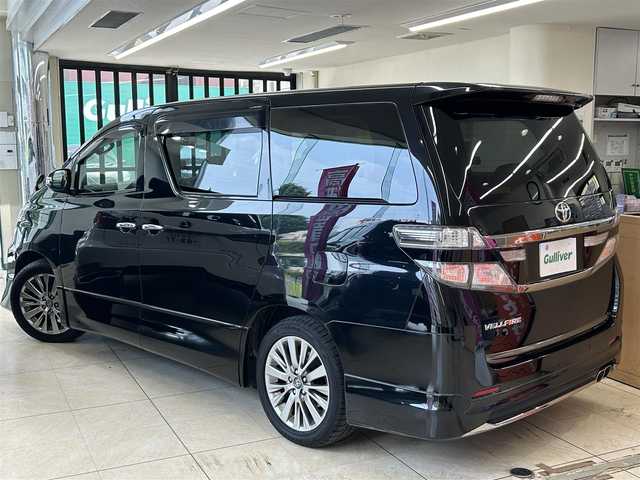 トヨタ ヴェルファイア 2．4Z ゴールデンアイズ 東京都 2012(平24)年 8.5万km ブラック 純正メーカーナビ/(CD/DVD/HDD/BT/USB/SD/フルセグTV)/純正前方ドライブレコーダー/(DRT-H68A)/バックカメラ/モデリスタエアロ/(フロント/リアアンダー)/純正フリップダウンモニター/革巻きステアリング/クルーズコントロール/コーナーセンサー/キャプテンシート/ハーフレザー/オットマン/パワーバックドア/イージークローザー/電動格納ウインカーミラー/LED/オートライト/フォグランプ/ステアリングスイッチ/横滑り防止機能/ドアバイザー/デュアルエアコン/カーテンエアバッグ/純正フロアマット/ISOFIX/新車時保証書/取扱説明書/定期点検記録簿