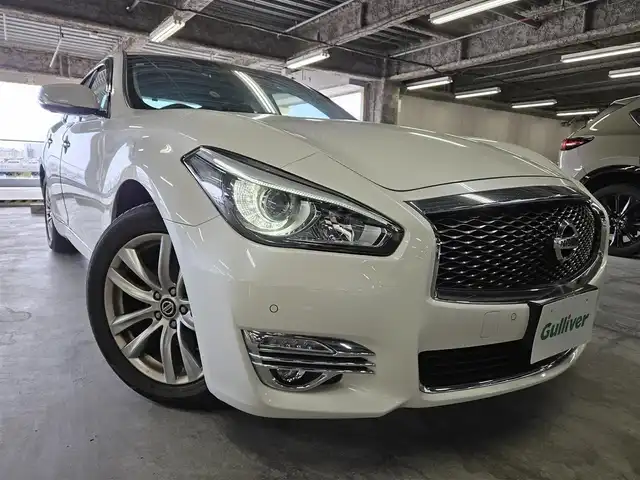 日産 フーガ 250GT 長崎県 2020(令2)年 7.7万km ブリリアントホワイトパール 〇純正８インチナビ/〇フルセグTV/〇バックカメラ/〇アラウンドビューモニター/〇ビルトインETC/〇ドライブレコーダー/〇後席モニター/〇インテリジェントクルーズコントロール/〇コーナーセンサー/〇運転支援システム/〇SRSエアバッグ/〇オートライト/〇LEDヘッドライト/〇LEDフロントフォグランプ/〇オートライト/〇革巻きステアリングホイール/〇フォレストエアコン/〇ブラックネオソフィール/ジャガード織物コンビシート/〇パワーシート/パワーオットマン/〇純正18インチアルミホイール/〇インテリジェントキー/〇禁煙車