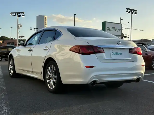日産 フーガ 250GT 長崎県 2020(令2)年 7.7万km ブリリアントホワイトパール 〇純正８インチナビ/〇フルセグTV/〇バックカメラ/〇アラウンドビューモニター/〇ビルトインETC/〇ドライブレコーダー/〇後席モニター/〇インテリジェントクルーズコントロール/〇コーナーセンサー/〇運転支援システム/〇SRSエアバッグ/〇オートライト/〇LEDヘッドライト/〇LEDフロントフォグランプ/〇オートライト/〇革巻きステアリングホイール/〇フォレストエアコン/〇ブラックネオソフィール/ジャガード織物コンビシート/〇パワーシート/パワーオットマン/〇純正18インチアルミホイール/〇インテリジェントキー/〇禁煙車