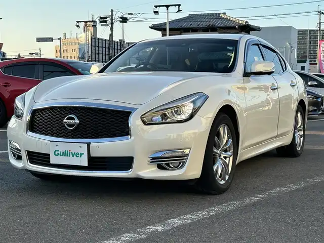 日産 フーガ 250GT 長崎県 2020(令2)年 7.7万km ブリリアントホワイトパール 〇純正８インチナビ/〇フルセグTV/〇バックカメラ/〇アラウンドビューモニター/〇ビルトインETC/〇ドライブレコーダー/〇後席モニター/〇インテリジェントクルーズコントロール/〇コーナーセンサー/〇運転支援システム/〇SRSエアバッグ/〇オートライト/〇LEDヘッドライト/〇LEDフロントフォグランプ/〇オートライト/〇革巻きステアリングホイール/〇フォレストエアコン/〇ブラックネオソフィール/ジャガード織物コンビシート/〇パワーシート/パワーオットマン/〇純正18インチアルミホイール/〇インテリジェントキー/〇禁煙車