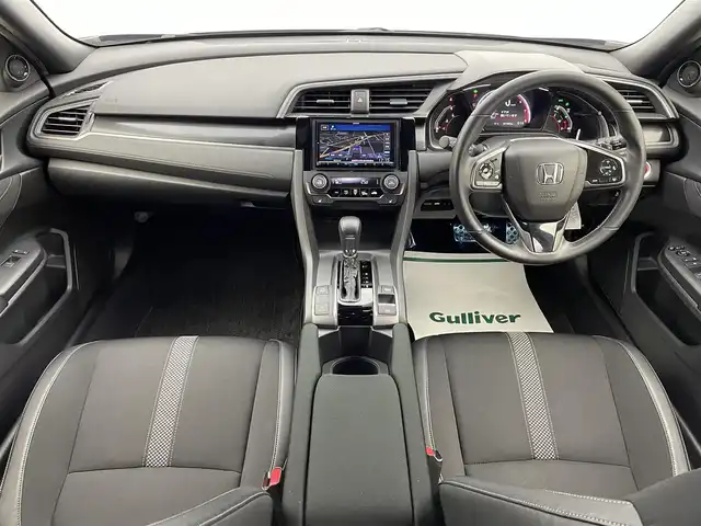 ホンダ シビック ハッチバック 宮城県 2020(令2)年 3.2万km オブシダンブルーパール ホンダセンシング　/ＨＫＳ２本出マフラー　/ブラックエンブレム　/ケンウッドナビＴＶ　/アダプティブクルーズコントロール/革コンビシート　/パワーシート　/ＬＥＤヘッドライト/オートハイビーム/追突軽減ブレーキ〈CMBS〉/路外逸脱抑制機能/ＥＴＣ２．０　/シートヒーター　/禁煙車