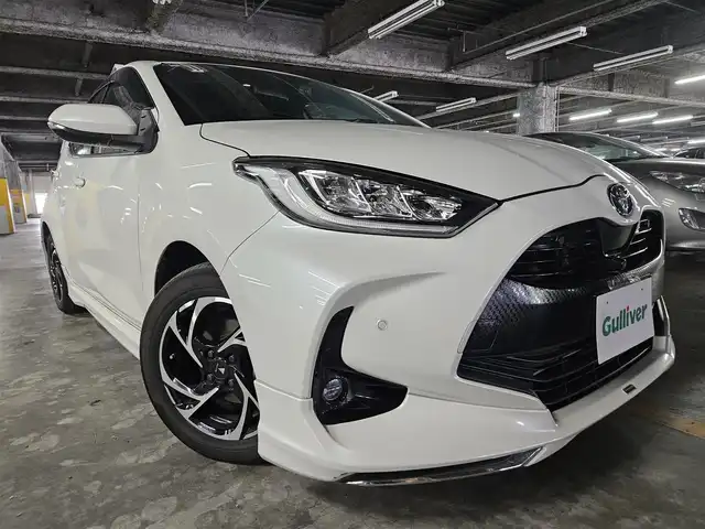 トヨタ ヤリス ハイブリッド Z 福岡県 2020(令2)年 7.9万km ホワイトパールクリスタルシャイン モデリスタエアロ(F/S/R)/モデリスタ15インチアルミホイール/パノラミックビューモニター/純正8型ディスプレイオーディオ/ビルトインETC/前後ドライブレコーダー/レーダークルーズコントロール/クリアランスソナー/セーフティセンス/・衝突被害軽減ブレーキ/・車線逸脱防止支援システム/・オートマチックハイビーム/・標識認識機能/・セカンダリーコリジョンブレーキ/フルLEDヘッドランプ/革巻きステアリング/上級ファブリックシート/前席シートヒーター/スマートキー/プッシュエンジンスタート/禁煙車