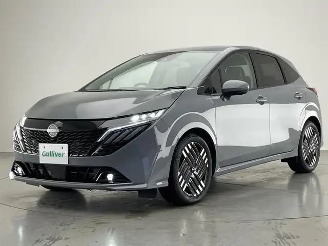 日産 オーラ G 愛知県 2024(令6)年 0.3万km グレー 純正９型ナビ　ＢＯＳＥ　プロパイロット　全方位カメラ　デジタルインナーミラー　ＨＤＭＩ　ワイヤレス充電　ＥＴＣ２．０　衝突軽減　追従クルコン　ＢＳＭ　黒ハーフレザー　フルセグ　パワーシート　純正ＡＷ