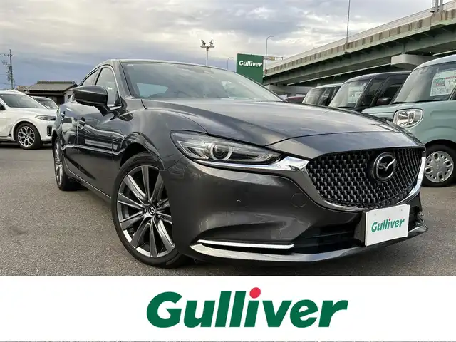 マツダ マツダ６セダン 25S Lパッケージ 愛知県 2019(令1)年 5.6万km マシーングレープレミアムM スマートキー/プッシュスタート/純正ナビ/フルセグTV/BT/USB /BOSEサウンドシステム/アラウンドビューモニター/ETC/純正19インチAW/レーンキープアシスト/スマートブレーキサポート/ブラインドスポットモニター/レーダークルーズコントロール/レザーシート/前席パワーシート（D席メモリー付き）/前席シートヒーター/エアシート/ハンドルヒーター/前後ドライブレコーダー/電動リアサンシェード/オートライト/純正フロアマット/LEDヘッドライト/取説、保証書
