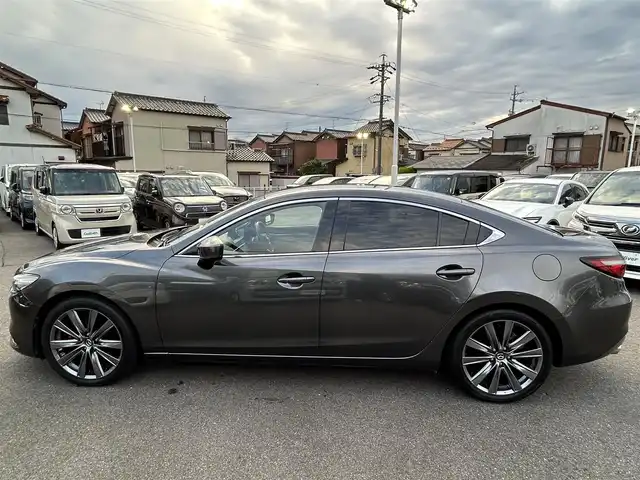 マツダ マツダ６セダン 25S Lパッケージ 愛知県 2019(令1)年 5.6万km マシーングレープレミアムM スマートキー/プッシュスタート/純正ナビ/フルセグTV/BT/USB /BOSEサウンドシステム/アラウンドビューモニター/ETC/純正19インチAW/レーンキープアシスト/スマートブレーキサポート/ブラインドスポットモニター/レーダークルーズコントロール/レザーシート/前席パワーシート（D席メモリー付き）/前席シートヒーター/エアシート/ハンドルヒーター/前後ドライブレコーダー/電動リアサンシェード/オートライト/純正フロアマット/LEDヘッドライト/取説、保証書