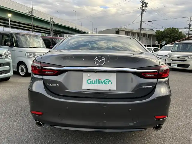 マツダ マツダ６セダン 25S Lパッケージ 愛知県 2019(令1)年 5.6万km マシーングレープレミアムM スマートキー/プッシュスタート/純正ナビ/フルセグTV/BT/USB /BOSEサウンドシステム/アラウンドビューモニター/ETC/純正19インチAW/レーンキープアシスト/スマートブレーキサポート/ブラインドスポットモニター/レーダークルーズコントロール/レザーシート/前席パワーシート（D席メモリー付き）/前席シートヒーター/エアシート/ハンドルヒーター/前後ドライブレコーダー/電動リアサンシェード/オートライト/純正フロアマット/LEDヘッドライト/取説、保証書