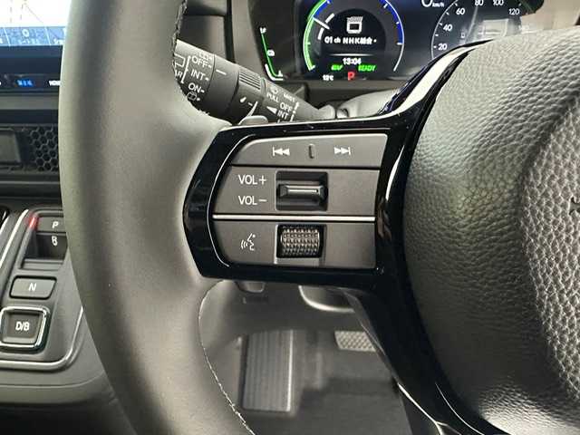 ホンダ ステップワゴン スパーダ eHEV 兵庫県 2025(令7)年 0.1千km プラチナホワイトパール 登録済未使用車/純正１１．４インチメモリナビ　（LXM-247VFLI）/（FM/AM、CD、DVD、BT、フルセグ）/純正１５．６インチ後席モニター/両側パワースライドドア/バックカメラ/レーダークルーズコントロール/パドルシフト/ホンダセンシング/ホンダコネクト/プッシュスタート/電動格納ミラー/ウィンカーミラー/ハーフレザーシート/シートヒーター（D/N席）/パワーバックドア/BSM/オットマン/LEDヘッドライト/LEDフォグランプ/オートライト/純正１６インチAW/本革巻ステアリングホイール/スマートキー×２