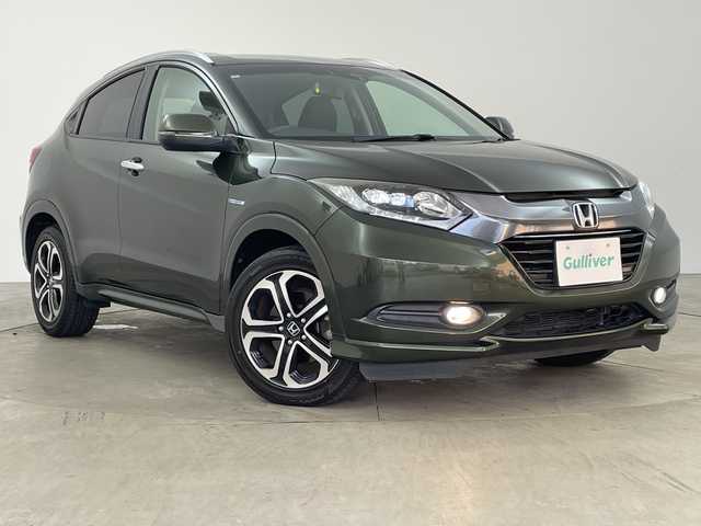 ホンダ ヴェゼル ハイブリッド Z 兵庫県 2015(平27)年 7.8万km ミスティックグリーンパール ・シティブレーキアクティブシステム/・カロッツェリア製7インチナビ＆フルセグ＆BT＆DVD/・バックカメラ/・クルーズコントロール/・電子パーキング/・オートホールド/・LEDヘッドライト/・オートライト/・スマートキー/・プッシュスタート/・横滑り防止装置/・ハーフレザーシート/・前席シートヒーター/・ルーフレール/・ETC/・社外フロアマット/・電動格納ミラー/・アイドリングストップ/・純正17インチアルミホイール