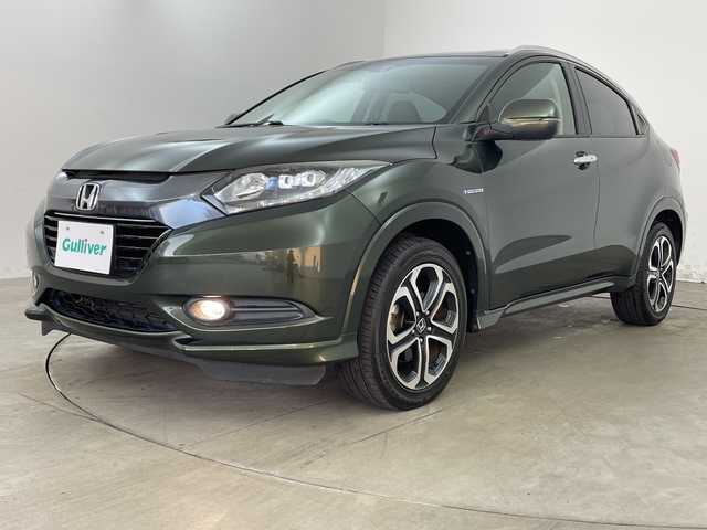 ホンダ ヴェゼル ハイブリッド Z 兵庫県 2015(平27)年 7.8万km ミスティックグリーンパール ・シティブレーキアクティブシステム/・カロッツェリア製7インチナビ＆フルセグ＆BT＆DVD/・バックカメラ/・クルーズコントロール/・電子パーキング/・オートホールド/・LEDヘッドライト/・オートライト/・スマートキー/・プッシュスタート/・横滑り防止装置/・ハーフレザーシート/・前席シートヒーター/・ルーフレール/・ETC/・社外フロアマット/・電動格納ミラー/・アイドリングストップ/・純正17インチアルミホイール