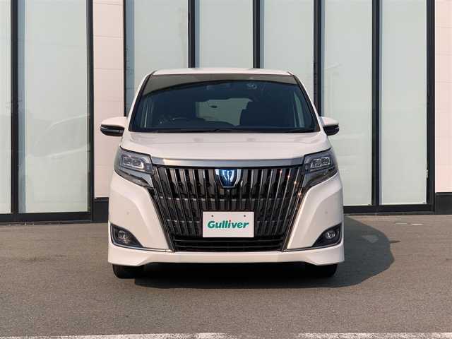 トヨタ エスクァイア ハイブリッド Gi プレミアムパッケージ 大阪府 2020(令2)年 2.9万km ホワイトパールクリスタルシャイン ワンオーナー/純正ナビ　/バックモニター/純正フリップダウンモニター　/ハーフレザーシート　/フルセグＴＶ　/両側パワースライドドア　/ビルトインＥＴＣ　/ハンドルヒーター　/ＵＳＢ充電ポート（前席2、後席2）　/ＨＤＭＩ接続/フォグランプ/LEDヘッドライト/後席バイザー/純正15インチアルミホイール/前後ドライブレコーダー