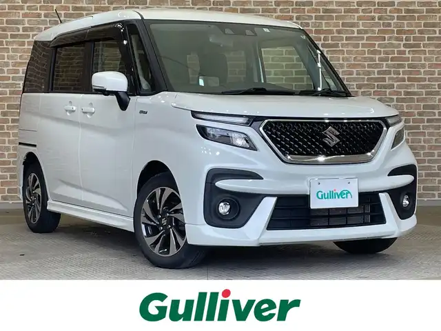 スズキ ソリオ バンディット HV MV 岩手県 2023(令5)年 0.1万km未満 ピュアホワイトP ４WD/ワンオーナー/ヘッドアップディスプレイ/両側パワースライドドア/全方位カメラ/シートヒーター/クルーズコントロール/レーンアシスト/コーナーセンサー/スズキセーフティサポート/衝突被害軽減ブレーキ/純正ナビ（Bluetooth CD DVD USB フルセグ）/横滑り防止装置/アイドリングストップ/オートハイビーム/LEDヘッドライト/フォグランプ/ETC/ロールサンシェード/シートバックテーブル