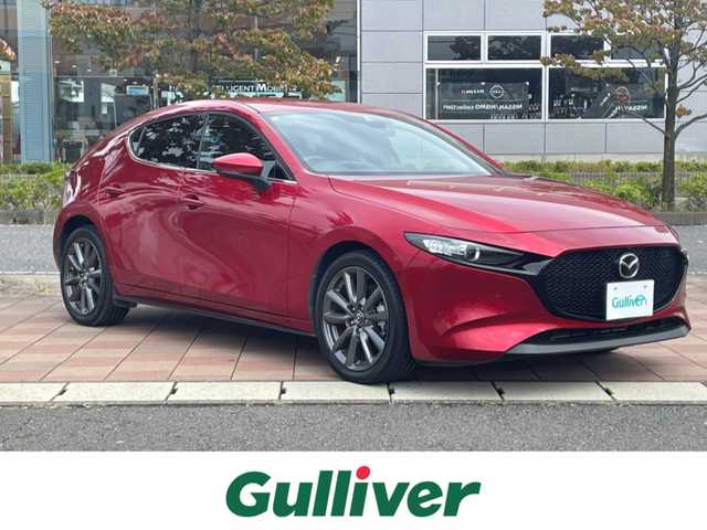 マツダ マツダ３ファストバック 15S ツーリング 福島県 2021(令3)年 2.8万km ソウルレッドクリスタルM 純正ナビゲーション(SD欠品)/【CD/DVD/USB/HDMI/TV】/360°ビューモニター/ドライブレコーダー/ビルトインETC/アクティブドライビングディスプレイ/ブラインドスポットモニタリング/車線逸脱警報システム/レーンキープアシストシステム/レーダークルーズコントロール/アイドリングストップ/LEDオートライト/純正フロアマット