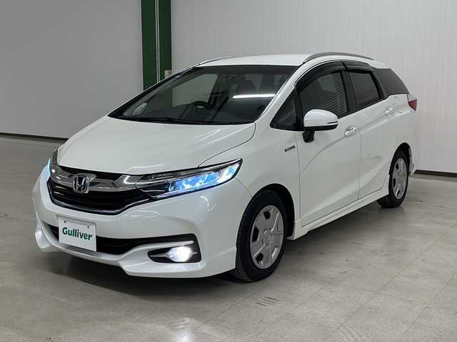ホンダ シャトル ハイブリッド Z 熊本県 2016(平28)年 9.3万km ホワイトオーキッドパール 純正ナビ（Gathers/VXM-175VFEi）/・Bluetoothオーディオ/USBオーディオ/・フルセグTV/DVD/AUX/HDMI/バックカメラ/シートヒーター（前席）/クルーズコントロール/LEDヘッドランプ/オートライト機能付/革巻きステアリングホイール/ドライブレコーダー（DRV-650）/ビルトインETC/横滑り防止装置/スペアキー1本