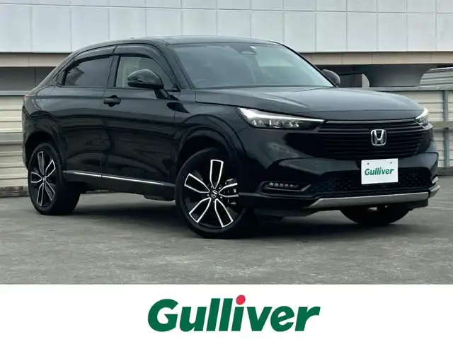 ホンダ ヴェゼル ハイブリッド e:HEV Z 静岡県 2022(令4)年 2.8万km クリスタルブラックパール ホンダセンシング/ケンウッド９型ナビ/フルセグTV/ＤＶＤ/ＥＴＣ/ＬＫＡ/ＡＣＣ/バックカメラ/ハーフレザー/ハンドル＆シートヒーター/ブラインドスポットインフォメーション/パドルシフト/純正１８ＡＷ/ハンズフリーアクセスパワーテールゲート（予約クローズ機能付）LEDシーケンシャルターンシグナルランプ（フロント）/クリアブラック塗装バンパーガーニッシュ（フロント/サイド/リア）/親水/ヒーテッドドアミラー/熱線入りフロントウインドウ/本革巻セレクトレバー/車速連動間欠/バリアブル間欠フロントワイパー（ミスト機構付）〈雨滴検知式〉/LEDフォグライト/ヒルディセントコントロール