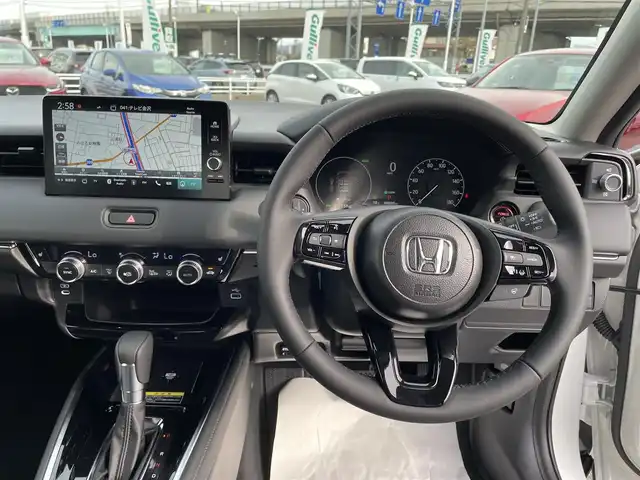 ホンダ ヴェゼル ハイブリッド e:HEV Z 石川県 2025(令7)年 0.1千km パール 登録済未使用車/4WD/純正9型ナビ/フルセグTV/バックカメラ/LEDヘッドライト/パワーバックドア/ホンダセンシング/レーダークルーズ/ETC2.0車載器/ワイヤレス充電器/フロントグリル(ベルリナブラック)/ハーフレザーシート/シートヒーター/スマートキー/プッシュスタート/保証書