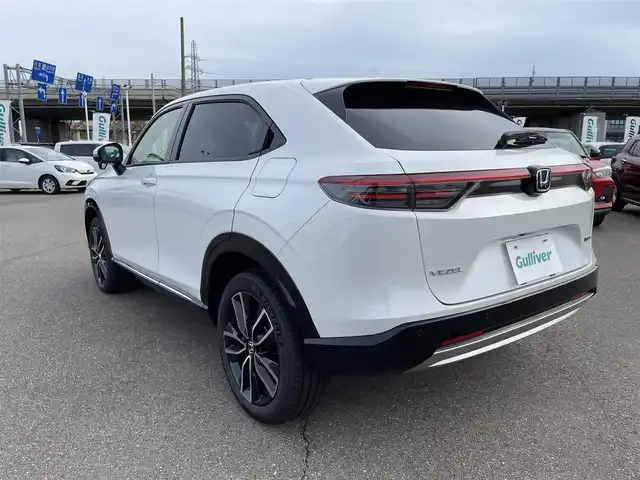 ホンダ ヴェゼル ハイブリッド e:HEV Z 石川県 2025(令7)年 0.1千km パール 登録済未使用車/4WD/純正9型ナビ/フルセグTV/バックカメラ/LEDヘッドライト/パワーバックドア/ホンダセンシング/レーダークルーズ/ETC2.0車載器/ワイヤレス充電器/フロントグリル(ベルリナブラック)/ハーフレザーシート/シートヒーター/スマートキー/プッシュスタート/保証書