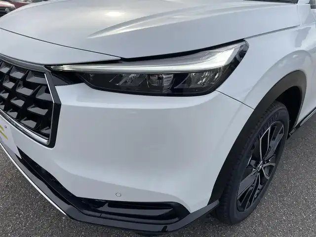 ホンダ ヴェゼル ハイブリッド e:HEV Z 石川県 2025(令7)年 0.1千km パール 登録済未使用車/4WD/純正9型ナビ/フルセグTV/バックカメラ/LEDヘッドライト/パワーバックドア/ホンダセンシング/レーダークルーズ/ETC2.0車載器/ワイヤレス充電器/フロントグリル(ベルリナブラック)/ハーフレザーシート/シートヒーター/スマートキー/プッシュスタート/保証書