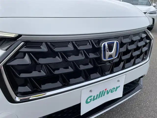 ホンダ ヴェゼル ハイブリッド e:HEV Z 石川県 2025(令7)年 0.1千km パール 登録済未使用車/4WD/純正9型ナビ/フルセグTV/バックカメラ/LEDヘッドライト/パワーバックドア/ホンダセンシング/レーダークルーズ/ETC2.0車載器/ワイヤレス充電器/フロントグリル(ベルリナブラック)/ハーフレザーシート/シートヒーター/スマートキー/プッシュスタート/保証書