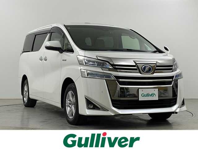 トヨタ ヴェルファイア ハイブリット X 道央・札幌 2019(平31)年 5.5万km ホワイトパールクリスタルシャイン ○4WD/○ツインムーンルーフ/○純正ナビ(BT/CD/DVD)/○フルセグTV/○パワースライドドア(両側)/○バックカメラ/○ビルトインETC2.0/○コムテックドライブレコーダー/○レーダークルーズコントロール/○クリアランスソナー/○セーフティセンス/・プリクラッシュセーフティ/・ロードサインアシスト/・レーントレーシングアシスト/・オートマチックハイビーム/○2眼LEDヘッドランプ/○デュアルオートエアコン/○本革巻きステアリング/○ステアリングカバー付/○ベージュファブリックシート/○2列目チップアップシート/○純正16インチアルミホイール/○スマートエントリー/プッシュスタートシステム