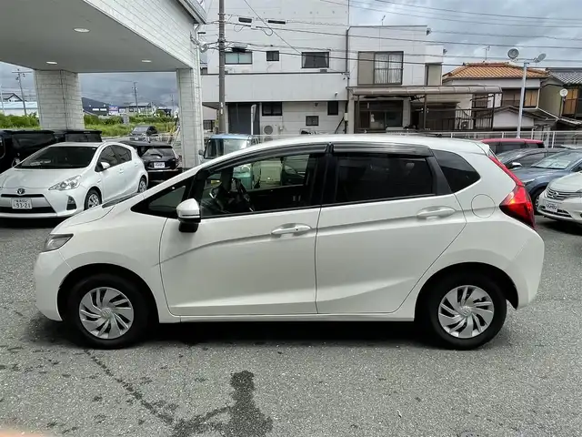 ホンダ フィット 13G Lパッケージ 愛知県 2015(平27)年 4.6万km プレミアムホワイトパール (株)IDOMが運営する【じしゃロン豊川店】の自社ローン専用車両になります。こちらは現金またはオートローンご利用時の価格です。自社ローンご希望の方は別途その旨お申付け下さい/ 純正ディーラーナビ/　◯ CD再生機能/ ETC/ バックカメラ/ プッシュスタート/ ドライブレコーダー/ ウインカーミラー/ ドアバイザー/ 純正フロアマット