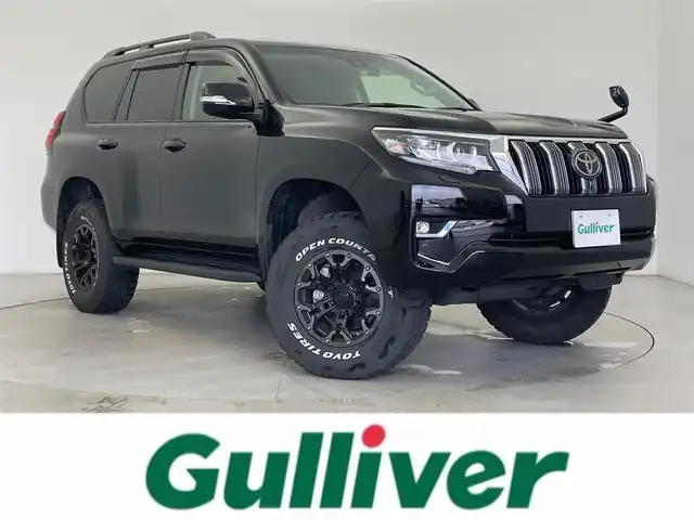トヨタ ランドクルーザー プラド TX Lパッケージ 富山県 2023(令5)年 3.2万km ブラック サンルーフ/社外9型ナビ（AM/FM/BT/DVD/USB/HDMI）/フルセグTV/バックカメラ/ドライブレコーダー/ETC/レザーシート/前席パワーシート/前席シートヒーター/前席エアシート/衝突被害軽減システム/レーダークルーズコントロール/レーンキープアシスト/コーナーセンサー/横滑り防止装置/オートLEDライト/純正フロアマット/マーテルギア製アルミホイール/革巻きステアリング/ステアリングスイッチ/リフトアップ有