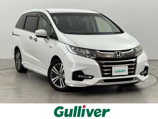 ホンダ オデッセイ ハイブリッド アブソルート ホンダセンシング 福岡県 2018(平30)年 8.2万km プラチナホワイトパール 純正９インチナビ／フルセグＴＶ／ＢＴ　/ＥＴＣ２．０　/ドライブレコーダー　/両側パワースライドドア　/バックカメラ/クルーズコントロール　/衝突軽減システム　/レーンキープ　/コーナーセンサー　/横滑り防止　/純正１７インチＡＷ