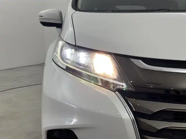 ホンダ オデッセイ ハイブリッド アブソルート ホンダセンシング 福岡県 2018(平30)年 8.2万km プラチナホワイトパール 純正９インチナビ／フルセグＴＶ／ＢＴ　/ＥＴＣ２．０　/ドライブレコーダー　/両側パワースライドドア　/バックカメラ/クルーズコントロール　/衝突軽減システム　/レーンキープ　/コーナーセンサー　/横滑り防止　/純正１７インチＡＷ