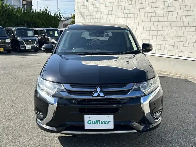 三菱 アウトランダー ＰＨＥＶ G プレミアムパッケージ 山形県 2016(平28)年 9.4万km アメジストブラック 4WD/純正SDナビ/フルセグTV/FM/AM/クルーズコントロール/全周囲カメラ/社外サス（純正有り）/ステアリングヒーター/黒革シート&シートヒーター/パワーバックドア/パドルソフト/衝突軽減ブレーキ/ドライブレコーダー/パドルシフト/バックカメラ/ETC/純正アルミ付き冬タイヤ積載/充電ケーブル