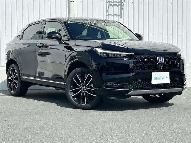 ホンダ ヴェゼル ハイブリッド e:HEV Z 三重県 2025(令7)年 0.1千km クリスタルブラックパール 登録済未使用車 /純正ナビ /バックカメラ /BSM /ビルトインETC2.0 /ワイヤレス充電器 /スペアキー/ステアリングヒーター /革巻きステアリング/ステアリングスイッチ/パワーバックドア /前席シートヒーター/USB・タイプC給電ポート/コーナーセンサー /ハーフレザーシート/レーダークルーズコントロール/レーンキープアシスト/衝突軽減ブレーキ/ダウンヒルアシストコントロール/LEDヘッドライト/オートハイビーム/オートライト/電動格納ミラー/禁煙車
