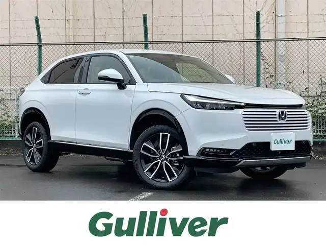 ホンダ ヴェゼル ハイブリッド e:HEV Z 東京都 2025(令7)年 0.1千km プラチナホワイトパール 登録済未使用車/純正ナビ/置型充電/BSM/ETC2.0/レーダークルーズコントロール/18インチ純正ホイール/純正LED/電動リアケート/シートヒーター/衝突被害軽減ブレーキ/盗難防止装置