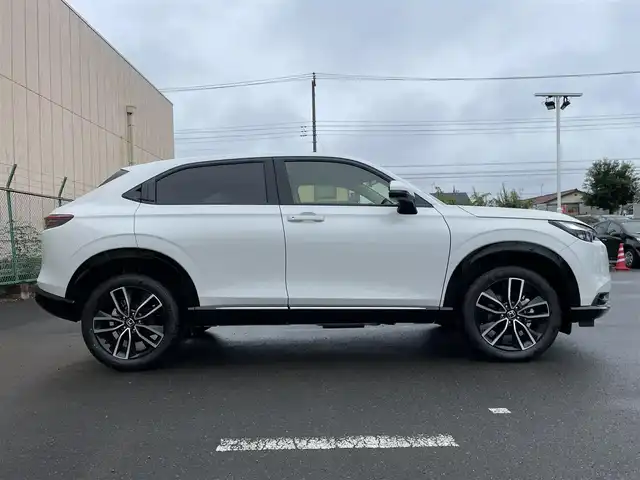 ホンダ ヴェゼル ハイブリッド e:HEV Z 東京都 2025(令7)年 0.1千km プラチナホワイトパール 登録済未使用車/純正ナビ/置型充電/BSM/ETC2.0/レーダークルーズコントロール/18インチ純正ホイール/純正LED/電動リアケート/シートヒーター/衝突被害軽減ブレーキ/盗難防止装置