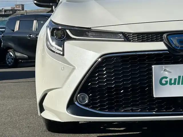 トヨタ カローラツーリング ハイブリッド ダブルバイビー 愛知県 2020(令2)年 2.5万km ホワイトパールクリスタルシャイン ＤＡ９インチナビ　/Ｂカメラ　/ＥＴＣ　/ＢＴ　/ＵＳＢ　/衝突軽減ブレーキ　/クリアランスソナー　/ステアリングスイッチ　/ＬＥＤヘッドライト　/置くだけ充電　/ＡＣ１００Ｖ　/Ｆドラレコ　/純正１７インチＡＷ
