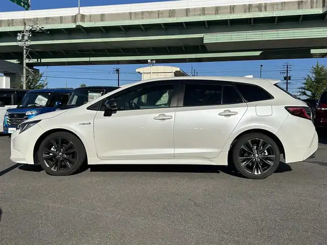 トヨタ カローラツーリング ハイブリッド ダブルバイビー 愛知県 2020(令2)年 2.5万km ホワイトパールクリスタルシャイン ＤＡ９インチナビ　/Ｂカメラ　/ＥＴＣ　/ＢＴ　/ＵＳＢ　/衝突軽減ブレーキ　/クリアランスソナー　/ステアリングスイッチ　/ＬＥＤヘッドライト　/置くだけ充電　/ＡＣ１００Ｖ　/Ｆドラレコ　/純正１７インチＡＷ