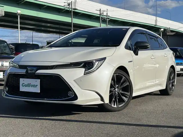 トヨタ カローラツーリング ハイブリッド ダブルバイビー 愛知県 2020(令2)年 2.5万km ホワイトパールクリスタルシャイン ＤＡ９インチナビ　/Ｂカメラ　/ＥＴＣ　/ＢＴ　/ＵＳＢ　/衝突軽減ブレーキ　/クリアランスソナー　/ステアリングスイッチ　/ＬＥＤヘッドライト　/置くだけ充電　/ＡＣ１００Ｖ　/Ｆドラレコ　/純正１７インチＡＷ