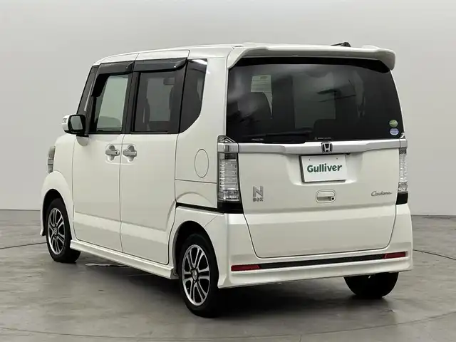 ホンダ Ｎ ＢＯＸ カスタム G SSパッケージ 福岡県 2013(平25)年 9.3万km プレミアムホワイトパール 社外ディスプレイオーディオ（ＢＴ）　/バックカメラ　/両側電動スライドドア　/横滑り防止装置　/ＥＣＯＮ　/プッシュスタート　/電動格納式ドアミラー　/純正フロアマット　/オートライト　/純正１４インチアルミホイール