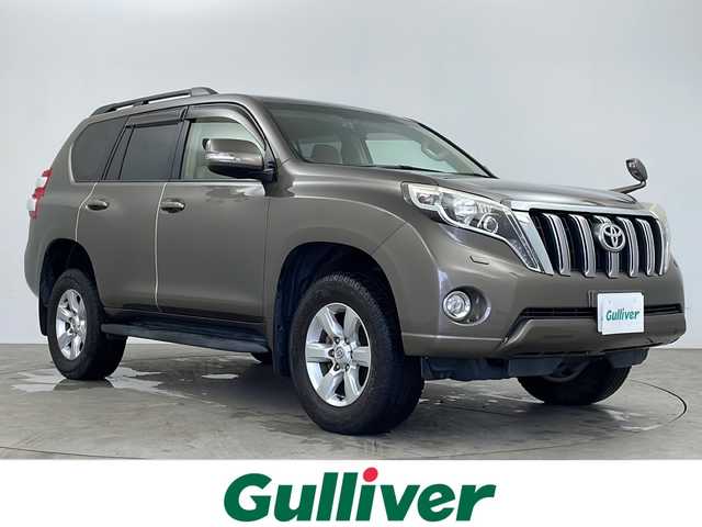 トヨタ ランドクルーザー プラド TX 鹿児島県 2015(平27)年 7.2万km ブロンズマイカメタリック 純正SDナビNSZT-W64/(BT/CD/DVD/AM/FM/フルセグTV)/バックカメラ/純正ビルトインETC/社外前後ドライブレコーダーDRV-MR745/ルーフレール/ヒルディセントコントロール/4WD/純正17インチアルミホイール/純正LEDヘッドライト/電格ミラー/ウィンカーミラー/ヘッドライトウォッシャー/フロントフォグライト/ドアバイザー