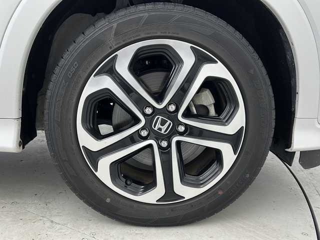 ホンダ ヴェゼル ハイブリッド Z ホンダセンシング 宮城県 2020(令2)年 2.5万km プラチナホワイトパール 禁煙車/Honda SENSING			/・衝突軽減ブレーキ			/・路外逸脱抑制機能					/・アダプティブクルーズコントロール			/・車線維持支援システム			/純正９型ナビ/・CD.DVD.SD.USB.BT.HDMI/フルセグTV/バックカメラ/ドライブレコーダー(前後)/ハーフレザーシート/前席シートヒーター/革巻ステアリング/ステアリングスイッチ/パドルシフト/プッシュスタート/スマートキー/純正17inAW/純正フロアマット/ＬＥＤヘッドライト/ＬＥＤフォグランプ/ビルトインＥＴＣ/横滑り防止機能/ドアバイザー/アイドリングストップ