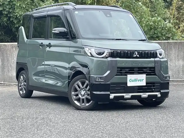 三菱 デリカミニ T プレミアム 鹿児島県 2024(令6)年 1.2万km 緑Ⅱ ワンオーナー/プッシュスタート/純正ナビ(FM/AM/BT/フルセグTV)/マイパイロット/パドルシフト/IC付ターボ/アイドリングストップ/ブレーキホールド/両側パワースライドドア/ビルトインETC/全方位カメラ/デジタルインナーミラー/ハーフレザーシート/DN席シートヒーター/純正フロアマット/純正アルミホイール/ルーフレール/オートライト/オートマチックハイビーム/ABS/ASC/HDC/DAA/FCM/LDW/LDP/TSR/LCDN/EAPM/ABSA/RCTA/PFCW/前後コーナーセンサー/スマートキー/取扱説明書/保証書