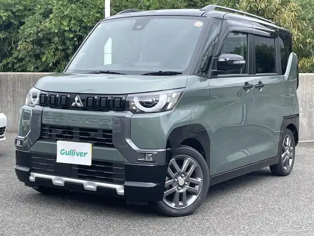 三菱 デリカミニ T プレミアム 鹿児島県 2024(令6)年 1.2万km 緑Ⅱ ワンオーナー/プッシュスタート/純正ナビ(FM/AM/BT/フルセグTV)/マイパイロット/パドルシフト/IC付ターボ/アイドリングストップ/ブレーキホールド/両側パワースライドドア/ビルトインETC/全方位カメラ/デジタルインナーミラー/ハーフレザーシート/DN席シートヒーター/純正フロアマット/純正アルミホイール/ルーフレール/オートライト/オートマチックハイビーム/ABS/ASC/HDC/DAA/FCM/LDW/LDP/TSR/LCDN/EAPM/ABSA/RCTA/PFCW/前後コーナーセンサー/スマートキー/取扱説明書/保証書