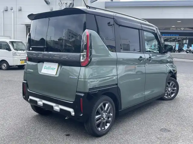 三菱 デリカミニ T プレミアム 鹿児島県 2024(令6)年 1.2万km 緑Ⅱ ワンオーナー/プッシュスタート/純正ナビ(FM/AM/BT/フルセグTV)/マイパイロット/パドルシフト/IC付ターボ/アイドリングストップ/ブレーキホールド/両側パワースライドドア/ビルトインETC/全方位カメラ/デジタルインナーミラー/ハーフレザーシート/DN席シートヒーター/純正フロアマット/純正アルミホイール/ルーフレール/オートライト/オートマチックハイビーム/ABS/ASC/HDC/DAA/FCM/LDW/LDP/TSR/LCDN/EAPM/ABSA/RCTA/PFCW/前後コーナーセンサー/スマートキー/取扱説明書/保証書