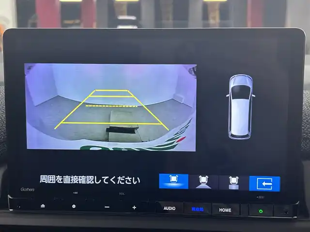 ホンダ ステップワゴン eHEV エアー EX 愛知県 2025(令7)年 0.1千km カジノホワイトパール 登録済未使用車/ターボ/純正11.4インチナビ/（CD/DVD/Bluetooth/フルセグTV/USB/SD)/バックカメラ/純正15.6インチフリップダウンモニター/ホンダセンシング/・衝突軽減ブレーキ/・レーンキープアシスト/・オートハイビーム/・ブラインドスポットモニター/・パーキングセンサー/・アダプティブクルーズコントロール/・誤発進抑制機能/シートヒーター/オットマン/両側パワースライドドア/パワーバックドア/パドルシフト/純正16インチアルミホイール/スマートキー/スペアキー1本/プッシュスタート/LEDヘッドライト/フロントフォグランプ/オートライト/横滑り防止装置/電子パーキングブレーキ/オートホールド/電動格納ミラー