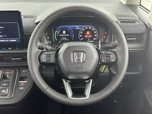 ホンダ ステップワゴン eHEV エアー EX 愛知県 2025(令7)年 0.1千km カジノホワイトパール 登録済未使用車/ターボ/純正11.4インチナビ/（CD/DVD/Bluetooth/フルセグTV/USB/SD)/バックカメラ/純正15.6インチフリップダウンモニター/ホンダセンシング/・衝突軽減ブレーキ/・レーンキープアシスト/・オートハイビーム/・ブラインドスポットモニター/・パーキングセンサー/・アダプティブクルーズコントロール/・誤発進抑制機能/シートヒーター/オットマン/両側パワースライドドア/パワーバックドア/パドルシフト/純正16インチアルミホイール/スマートキー/スペアキー1本/プッシュスタート/LEDヘッドライト/フロントフォグランプ/オートライト/横滑り防止装置/電子パーキングブレーキ/オートホールド/電動格納ミラー