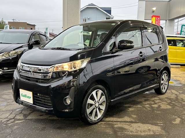 三菱 ｅＫカスタム T 道東・釧路十勝 2013(平25)年 5.7万km アメジストブラック 4WD/純正メモリーナビ/  (CD/フルセグTV)/バックカメラ/シートヒーター/HIDヘッドライト/フォグライト/ウィンカーミラー/電動格納ミラー/革巻きステアリング/純正フロアマット/純正ドアバイザー/スマートキー/エンジンプッシュスタート/純正15インチアルミホイール/冬タイヤ積み込み/  (155/65R14、7mm、2024年製、社外AW)