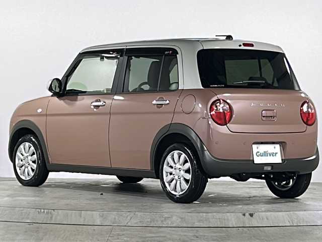 スズキ ラパン X 広島県 2024(令6)年 1.1万km テラコッタピンクメタリック/ソフトベージュ 2トーン 禁煙車/フルタイム４WD/デュアルカメラブレーキサポート/車線逸脱警報/オートハイビーム/純正８型ナビ（CN-FZ896）/・フルセグTV/・CD/Bluetooth/SD/REC/USB/全方位モニター/ステアリングスイッチ/革巻きステアリング/オートライト/D/Nシートヒーター/LEDヘッドライト/コーナーセンサー/電動格納ミラー/スマートキー/プッシュスタート/スペアキー/純正前後ドライブレコーダー/ETC/純正ドアバイザー/純正14インチアルミホイール