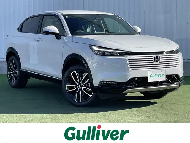 ホンダ ヴェゼル ハイブリッド e:HEV Z 香川県 2025(令7)年 0.1千km プラチナホワイトパール 登録済未使用車/純正９型ナビ/ワイヤレス充電器/バックカメラ/ビルトインＥＴＣ２．０/ホンダセンシング/レーダークルーズコントロール/ＢＳＭ/パドルシフト/ハンドルヒーター/シートヒーター/ハーフレザーシート/スペアキー/スマートキー