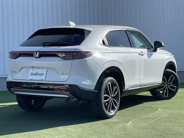 ホンダ ヴェゼル ハイブリッド e:HEV Z 香川県 2025(令7)年 0.1千km プラチナホワイトパール 登録済未使用車/純正９型ナビ/ワイヤレス充電器/バックカメラ/ビルトインＥＴＣ２．０/ホンダセンシング/レーダークルーズコントロール/ＢＳＭ/パドルシフト/ハンドルヒーター/シートヒーター/ハーフレザーシート/スペアキー/スマートキー