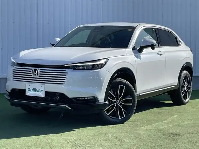 ホンダ ヴェゼル ハイブリッド e:HEV Z 香川県 2025(令7)年 0.1千km プラチナホワイトパール 登録済未使用車/純正９型ナビ/ワイヤレス充電器/バックカメラ/ビルトインＥＴＣ２．０/ホンダセンシング/レーダークルーズコントロール/ＢＳＭ/パドルシフト/ハンドルヒーター/シートヒーター/ハーフレザーシート/スペアキー/スマートキー