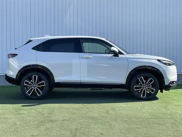 ホンダ ヴェゼル ハイブリッド e:HEV Z 香川県 2025(令7)年 0.1千km プラチナホワイトパール 登録済未使用車/純正９型ナビ/ワイヤレス充電器/バックカメラ/ビルトインＥＴＣ２．０/ホンダセンシング/レーダークルーズコントロール/ＢＳＭ/パドルシフト/ハンドルヒーター/シートヒーター/ハーフレザーシート/スペアキー/スマートキー
